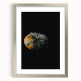 Textured abstract art print with shades of orange and brown, in a silver frame, suitable for bedroom decor.