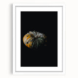 Abstract art print featuring warm autumnal shades on a white framed canvas, ideal for dining room decor.