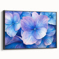 Framed canvas artwork showcasing an abstract floral design in vibrant colors, set against a sleek black frame. Ideal for modern home decor accents.