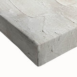 Close-up view of an abstract minimalist wall art design on stretched canvas, showcasing soft earth tones and geometric shapes, perfect for modern decor.