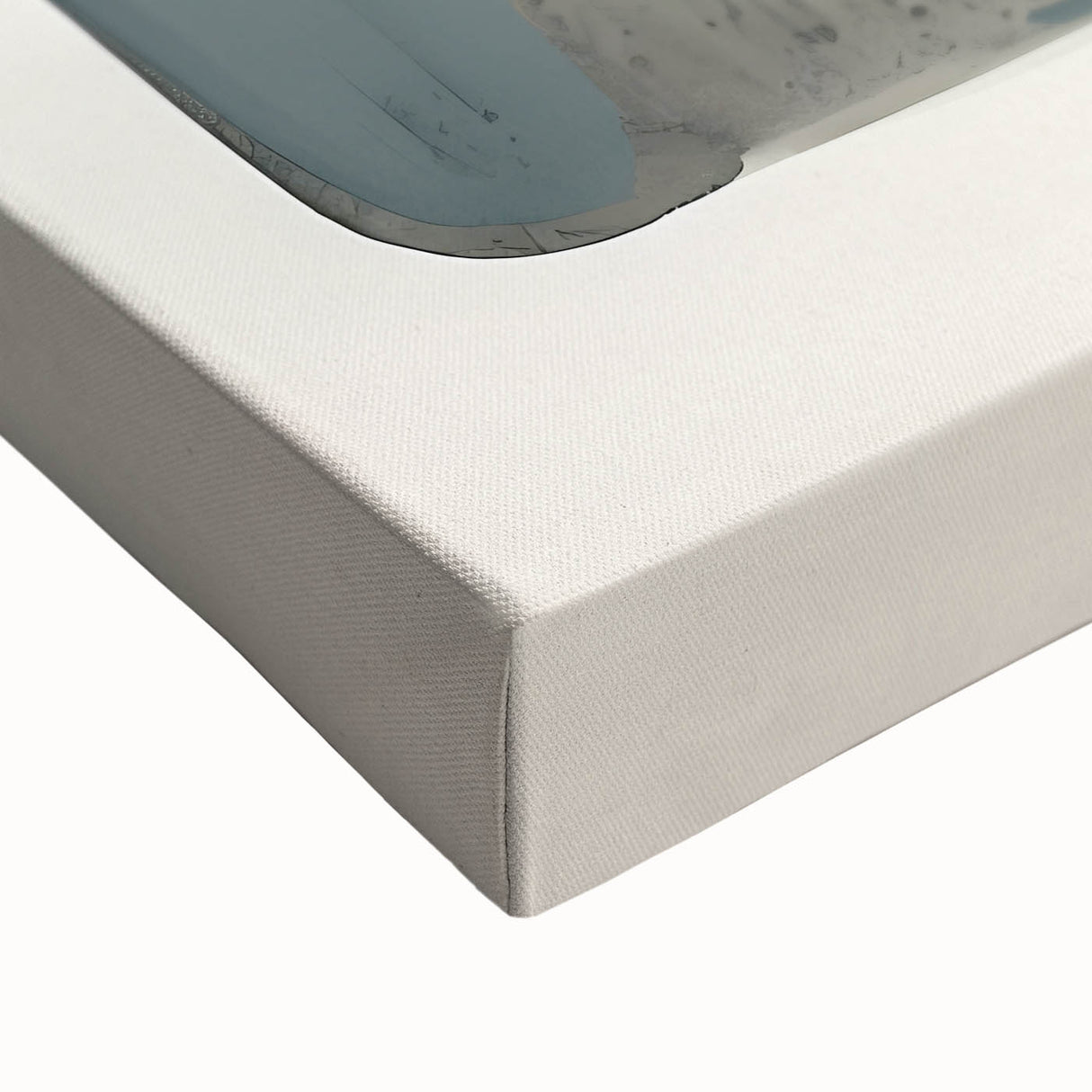 Abstract minimalist wall art on stretched canvas, showcasing soft pastel colors and geometric shapes, perfect for modern home decor. The artwork's textured surface adds visual depth, enhancing any contemporary setting.