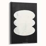 Framed minimalist wall art canvas showcasing an abstract design in black, viewed from the side, highlighting its sleek edges and modern aesthetic, perfect for contemporary decor.