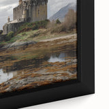 Close-up of a framed canvas artwork depicting a picturesque landscape with a majestic castle, featuring vibrant colors and intricate details, ideal for home decor.