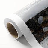 Rolled canvas artwork showcasing a vivid landscape featuring a majestic castle surrounded by lush greenery, presented in a durable cardboard tube for safe shipping and storage.