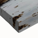 Close-up of a stretched canvas artwork depicting a serene landscape with a castle, showcasing rich colors and intricate details, ideal for home decor.