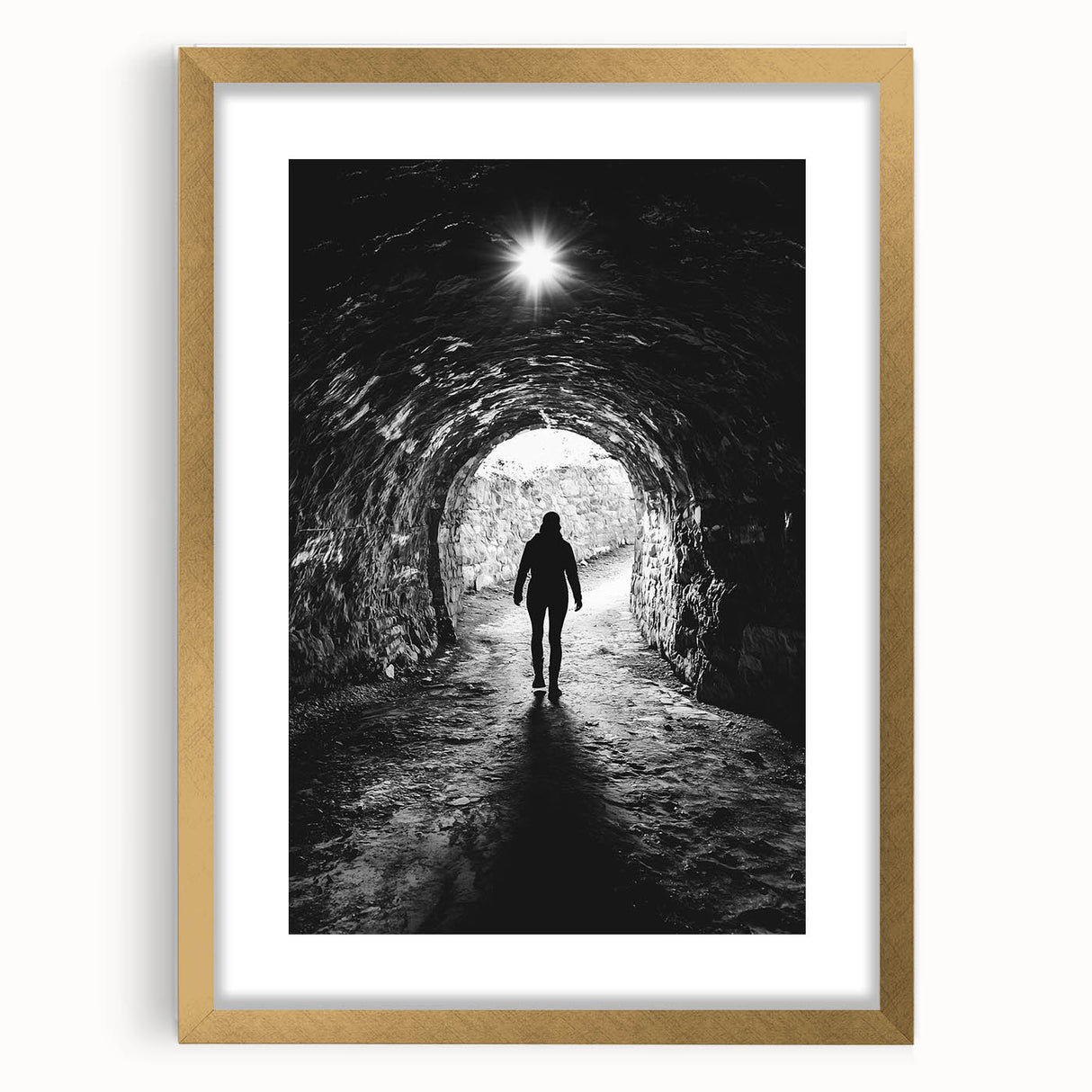 Elegant gold-framed landscape artwork featuring a serene cave scene, complete with a white mat, perfect for enhancing modern home decor and gallery displays.