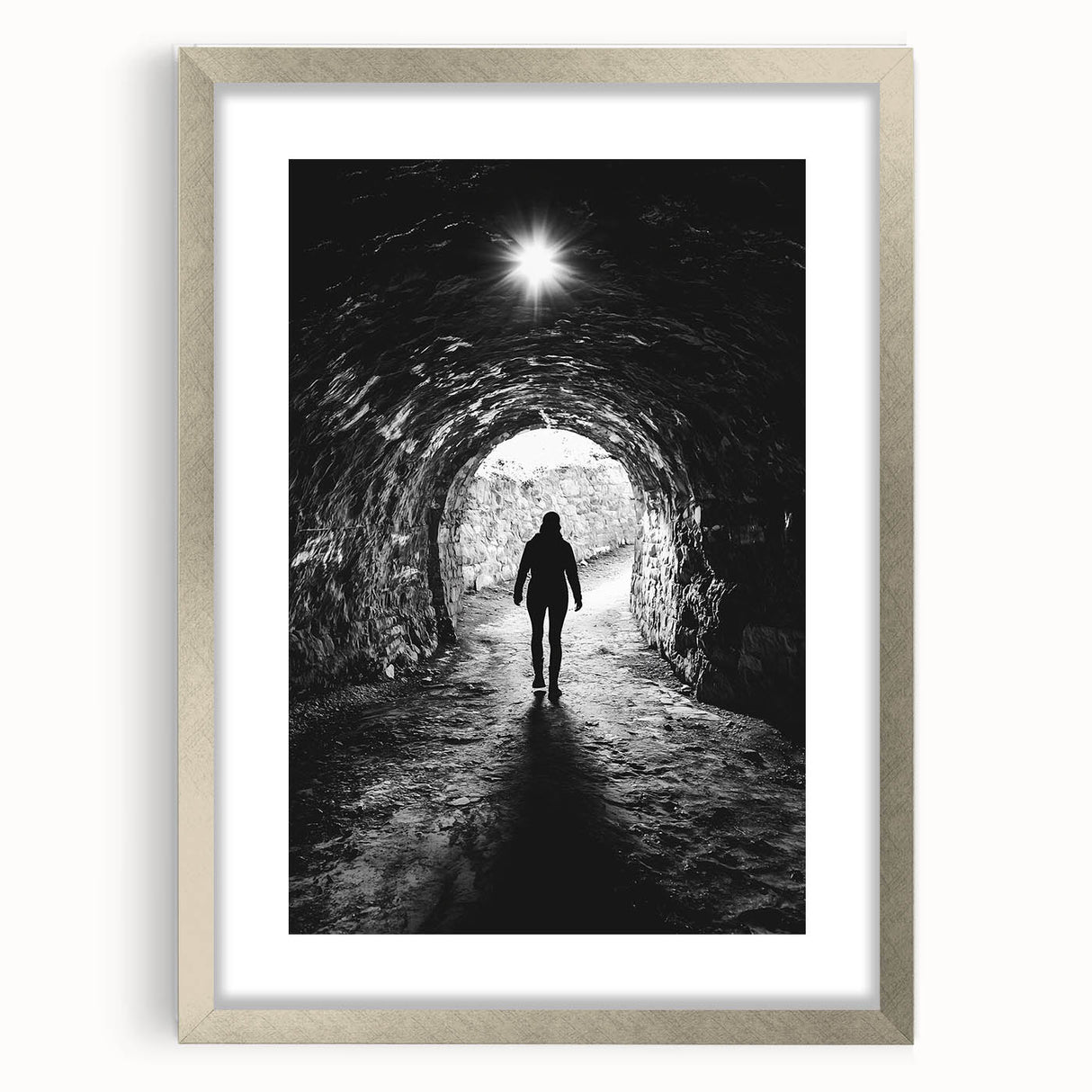 Silver-framed landscape artwork featuring intricate cave designs, elegantly presented with a white mat, perfect for enhancing any modern decor.