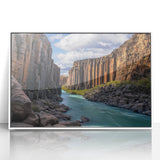 Framed acrylic artwork depicting a stunning cliff landscape with vibrant colors, set against a clean white background, perfect for home decor or office aesthetics.