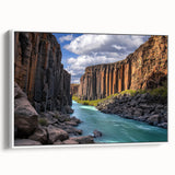 Framed canvas artwork depicting a stunning cliff landscape in vibrant colors, showcasing natural beauty with a white frame, ideal for modern home decor.