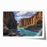 Stunning landscape print showcasing dramatic cliffs and vibrant colors, rolled for easy transport and display, perfect for enhancing home decor.