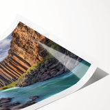 Stunning landscape canvas print showcasing dramatic cliffs against a vibrant sunset, rolled and securely packaged in a protective cardboard tube for easy transport.