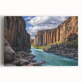Stretched canvas art showcasing a vibrant landscape of dramatic cliffs under a clear blue sky, perfect for enhancing any modern home or office decor.