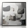 Abstract geometric framed acrylic art piece showcasing bold black shapes and lines on a white background, designed to enhance modern home decor.