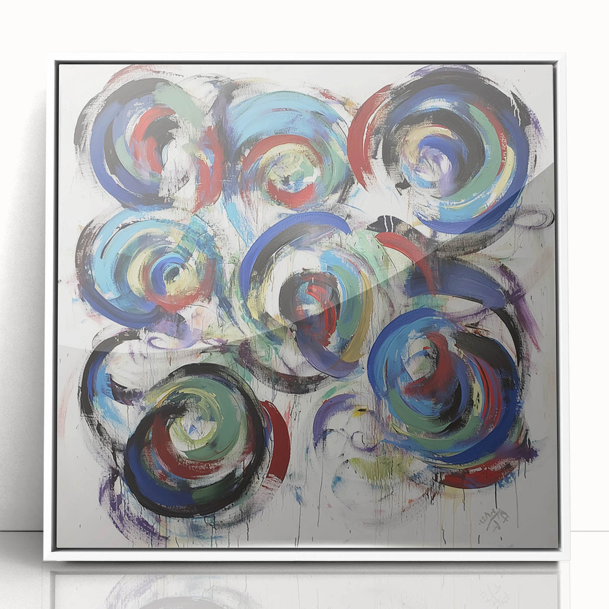 Framed acrylic art piece showcasing vibrant abstract splatters in various colors, presented in a sleek white frame, ideal for modern home decor and artistic display.