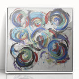 Framed acrylic art piece showcasing vibrant abstract splatters in various colors, presented in a sleek white frame, ideal for modern home decor and artistic display.