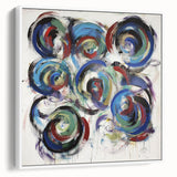Framed canvas artwork showcasing abstract splatter design in vibrant colors, positioned at a slight angle to highlight its textured surface and modern aesthetic. Ideal for contemporary home decor, this piece adds a dynamic visual element to any room.