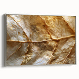 Framed canvas wall art showcasing an intricate design of flowers and botanical leaves with a silver frame, displayed from a side view, adding elegance to any decor.