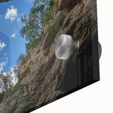 Close-up of a vibrant acrylic glass artwork depicting a stunning landscape of canyons, showcasing rich earth tones and intricate details, perfect for modern home decor.