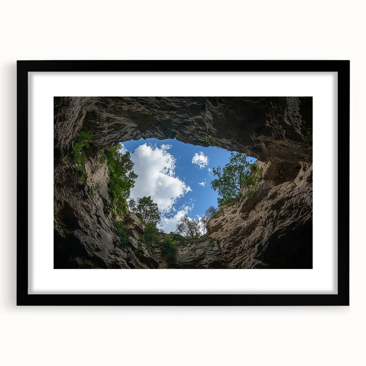 Black-framed landscape artwork featuring vibrant canyon scenery with a mat, showcasing rich earth tones and intricate details, perfect for home decor.