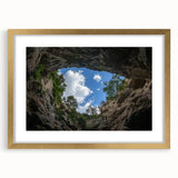 Framed landscape artwork of colorful canyons with a gold mat, showcasing intricate details and vibrant hues, perfect for home decor and artistic enhancement.