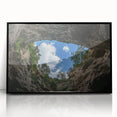 Framed acrylic artwork showcasing a stunning landscape of canyons with rich colors, presented in a sleek black frame, perfect for modern home decor.