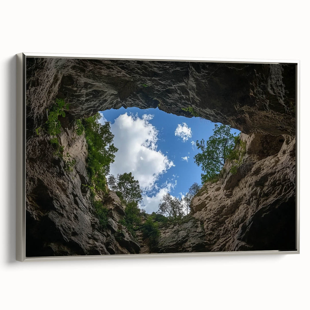 Framed landscape canvas depicting a stunning canyon scene with vibrant colors and detailed textures, featuring a sleek silver frame to enhance decor.