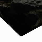 Close-up of a stretched canvas artwork depicting a vibrant landscape of canyons with rich earthy tones, ideal for home decor and nature enthusiasts.