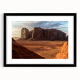 Framed landscape artwork showcasing a desert scene with vibrant colors and a black mat, ideal for modern home decor or office settings, adding a touch of nature.