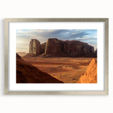 Desert landscape framed art print with a silver mat, showcasing warm tones of sandy hues and blue skies, perfect for modern home decor. Ideal for adding a serene touch to living spaces.