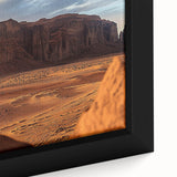 Close-up of a beautifully framed desert landscape canvas, showcasing vibrant hues of orange and blue, perfect for enhancing modern home decor. The intricate details highlight the natural beauty and serenity of arid environments, making it an ideal centerpiece for living spaces.