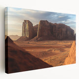 Desert landscape stretched canvas artwork showcasing vibrant hues of orange and yellow, depicting a serene sunset over rolling dunes, ideal for home decor.