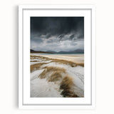 White-framed landscape artwork showcasing serene sand dunes at sunset, with a matting detail enhancing its elegance, ideal for modern home decor.