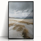 Framed acrylic wall art showcasing a serene landscape of rolling sand dunes, featuring a sleek black frame that adds elegance to any decor. The image captures soft, warm hues of the dunes under a clear blue sky, creating a tranquil atmosphere ideal for living spaces or offices.