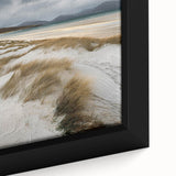Close-up of a framed canvas print depicting serene sand dunes under a vibrant blue sky, showcasing subtle texture and earthy tones, perfect for modern home decor.