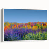 Framed canvas artwork showcasing a vibrant landscape with lush green fields and a serene sky, elegantly displayed from a side view against a white background. Ideal for home decor.