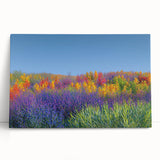 Stretched canvas artwork of vibrant green fields under a clear blue sky, showcasing a stunning landscape scene ideal for home decor and nature enthusiasts.