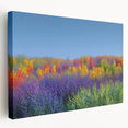 Stretched canvas artwork showcasing a vibrant landscape scene with rolling fields and a bright blue sky, perfect for enhancing home decor and adding a touch of nature.