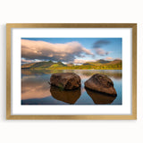 Abstract art print of Cumbria scenery in muted earth tones on a framed gold mat, suitable for dining room decor.
