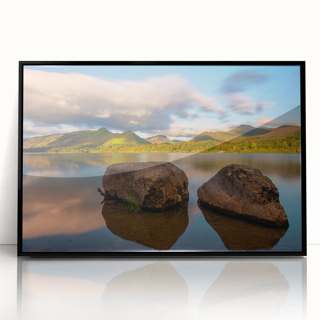Large abstract wall art depicting a serene Cumbrian landscape in muted green and blue tones, framed in black acrylic.