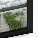 Close-up of a black framed canvas depicting a textured, colorful European scenery, ideal for living room decor.