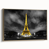 Framed canvas featuring a vintage poster art style landscape of Paris with black and gold tones.