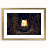 Abstract art print depicting a European scenery in muted gold and green tones on a framed canvas.