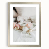 Textured abstract art print depicting spring themes in soft green and pink hues on a silver-framed canvas.