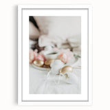 Abstract art print featuring soft pink and green swirls on a white framed canvas, ideal for dining room decor.