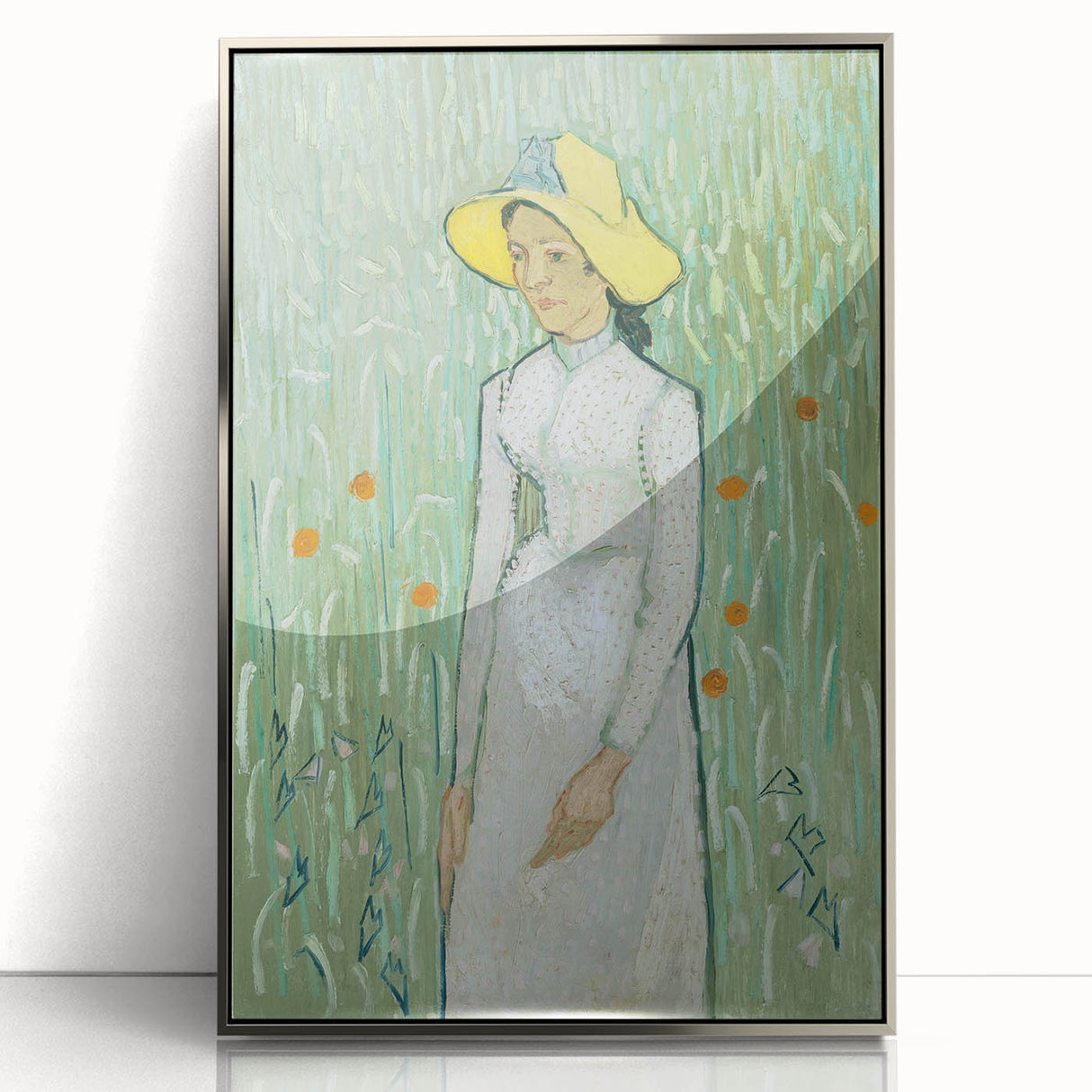 Large art print of Van Gogh's Starry Night in a silver frame, featuring vibrant blues and yellows.