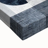 Close-up of abstract minimalist wall art on stretched canvas, showcasing soft earth tones and geometric shapes, perfect for modern home decor accents.