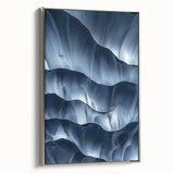Framed canvas artwork showcasing a stunning landscape scene with caves, featuring a sleek silver frame that enhances its visual appeal, ideal for home decor.