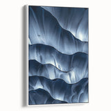 Framed canvas artwork showcasing a stunning cave landscape in vibrant colors, elegantly displayed with a white border, perfect for enhancing home decor aesthetics.