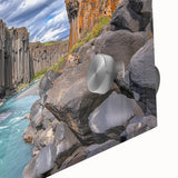 Close-up of an abstract acrylic painting showcasing vibrant cliffs and landscapes, highlighting intricate textures and colors on a glass surface, perfect for contemporary decor.