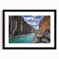 Black-framed landscape artwork showcasing dramatic cliffs and serene scenery, elegantly matted for a polished presentation, ideal for home decor or office spaces.